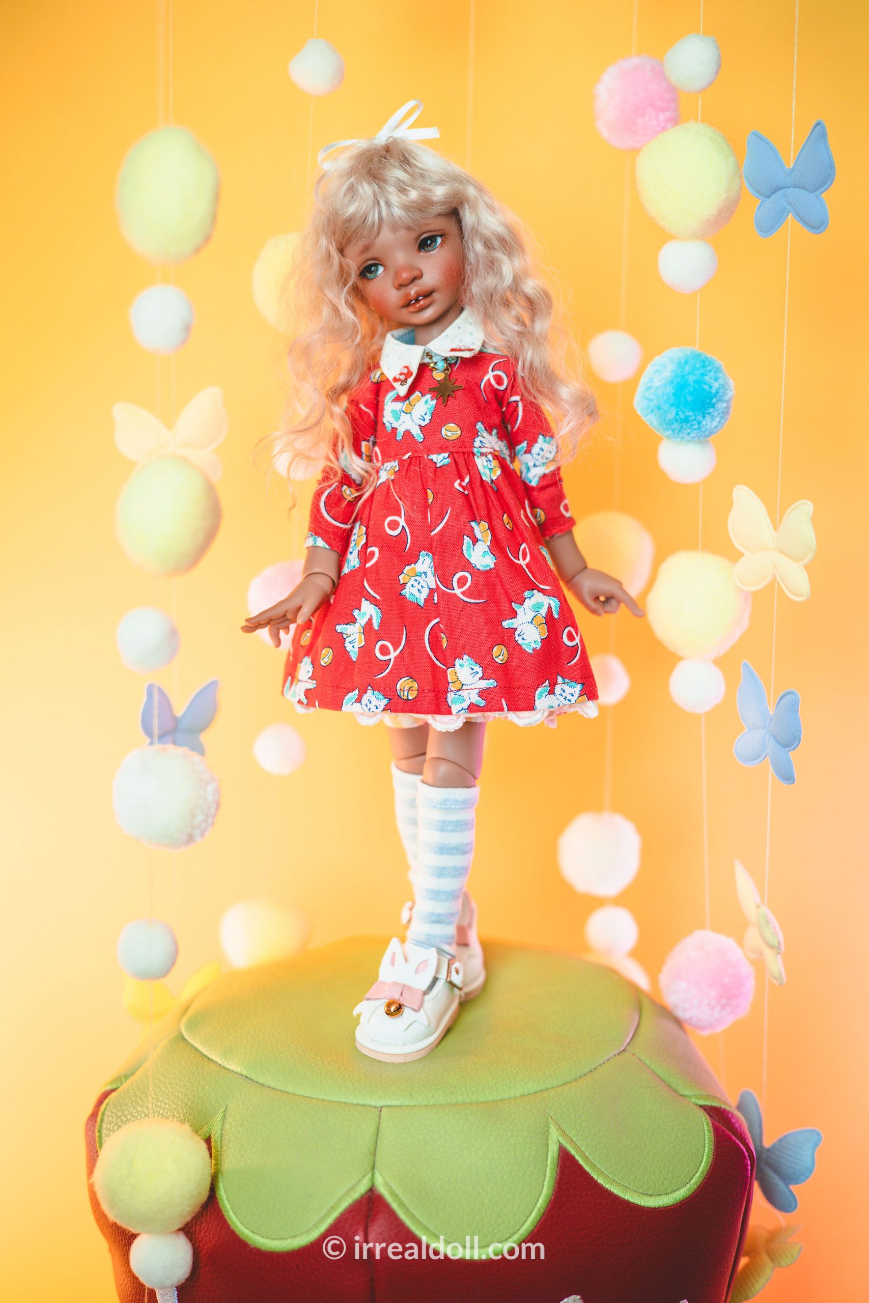 A picture of Surya, a 27cm tall doll from Irrealdoll in a dark skin tone.