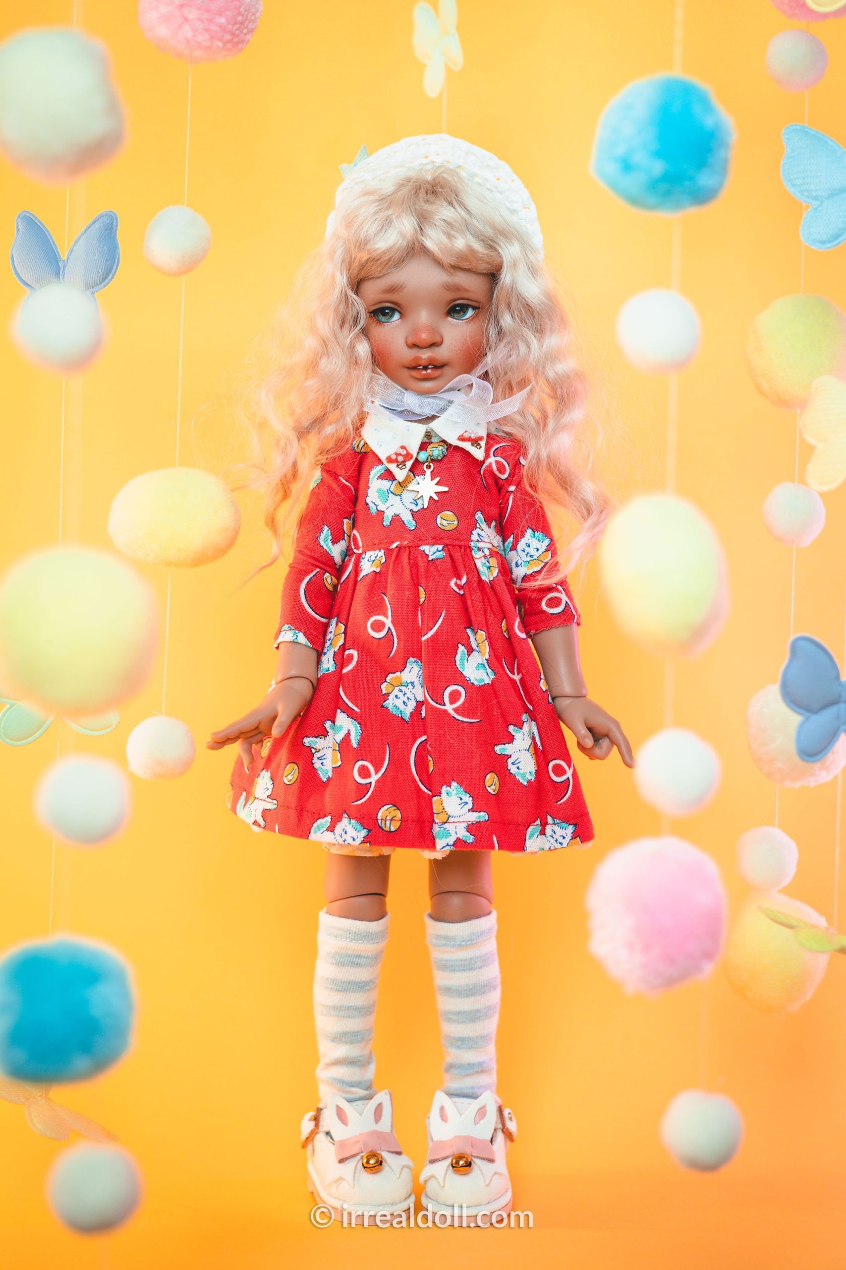 A picture of Surya, a 27cm tall doll from Irrealdoll in a dark skin tone.