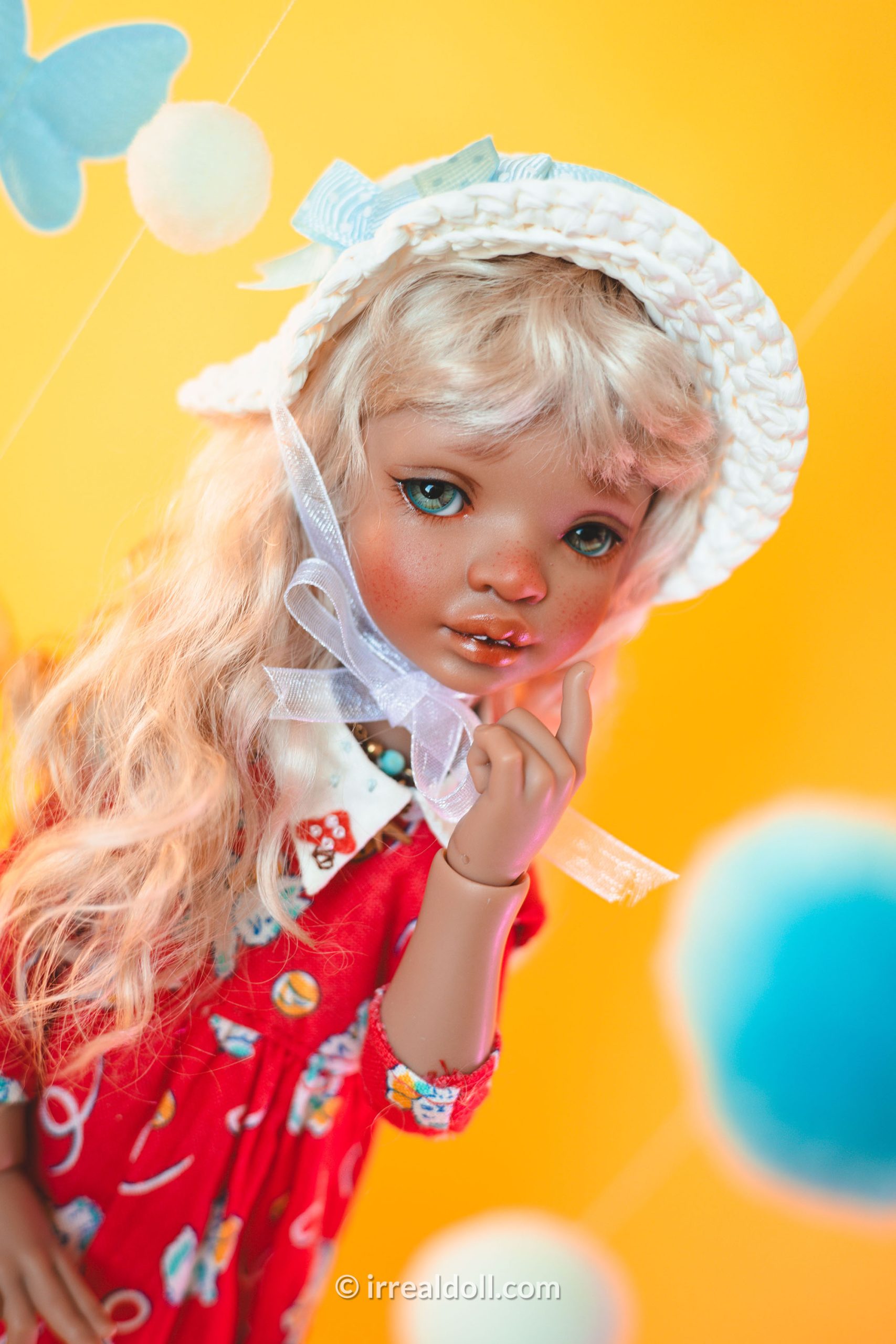 A picture of Surya, a 27cm tall doll from Irrealdoll in a dark skin tone.