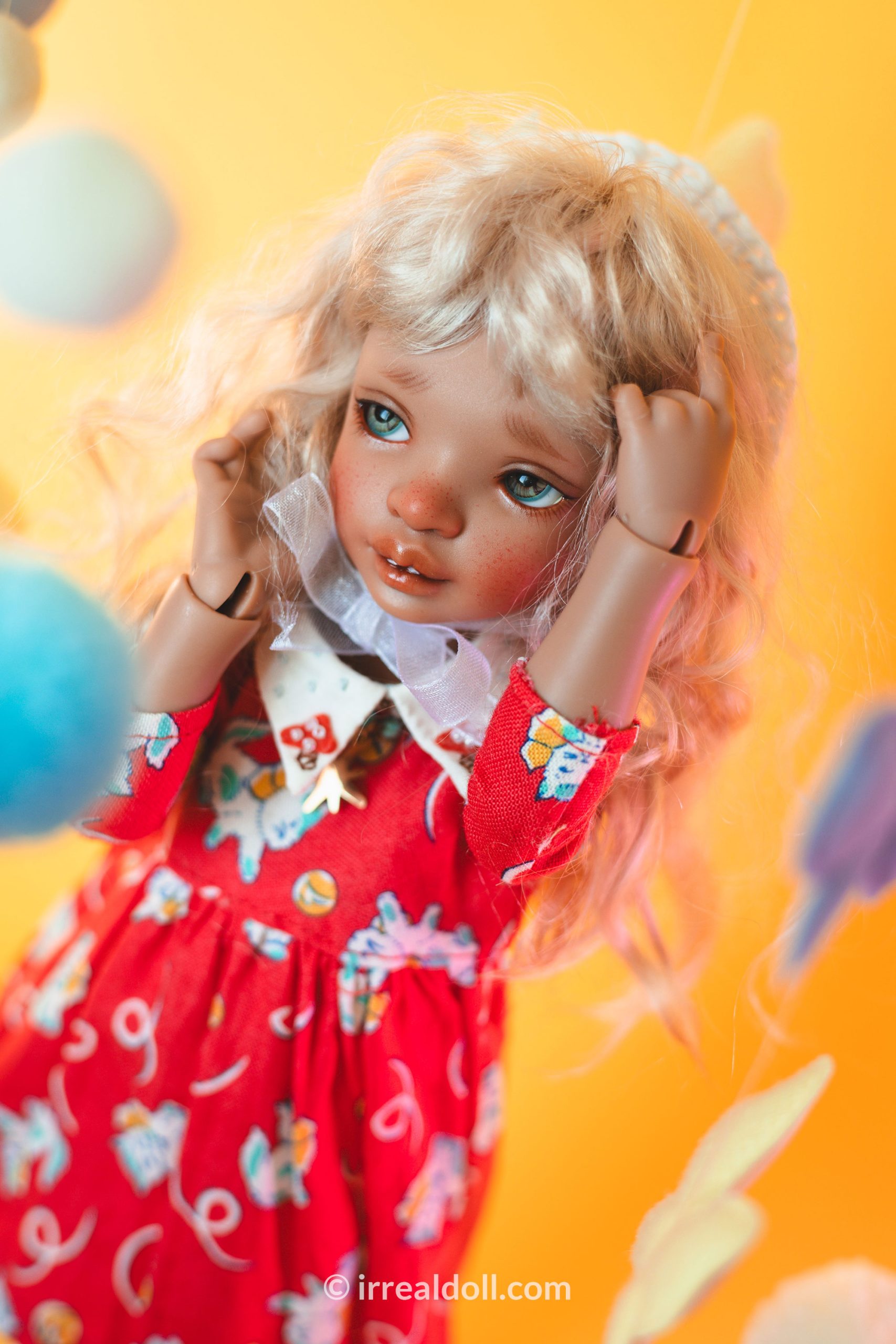 A picture of Surya, a 27cm tall doll from Irrealdoll in a dark skin tone.