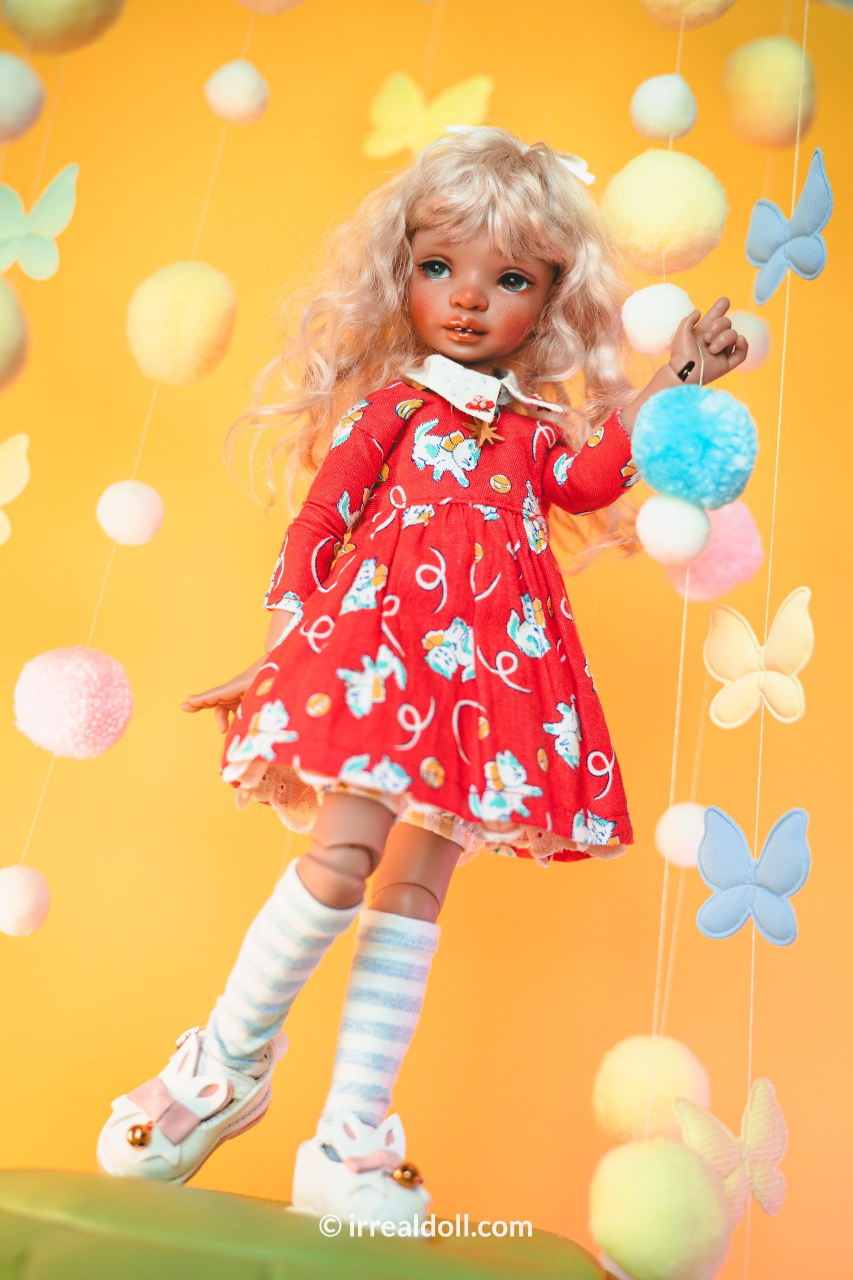 A picture of Surya, a 27cm tall doll from Irrealdoll in a dark skin tone.