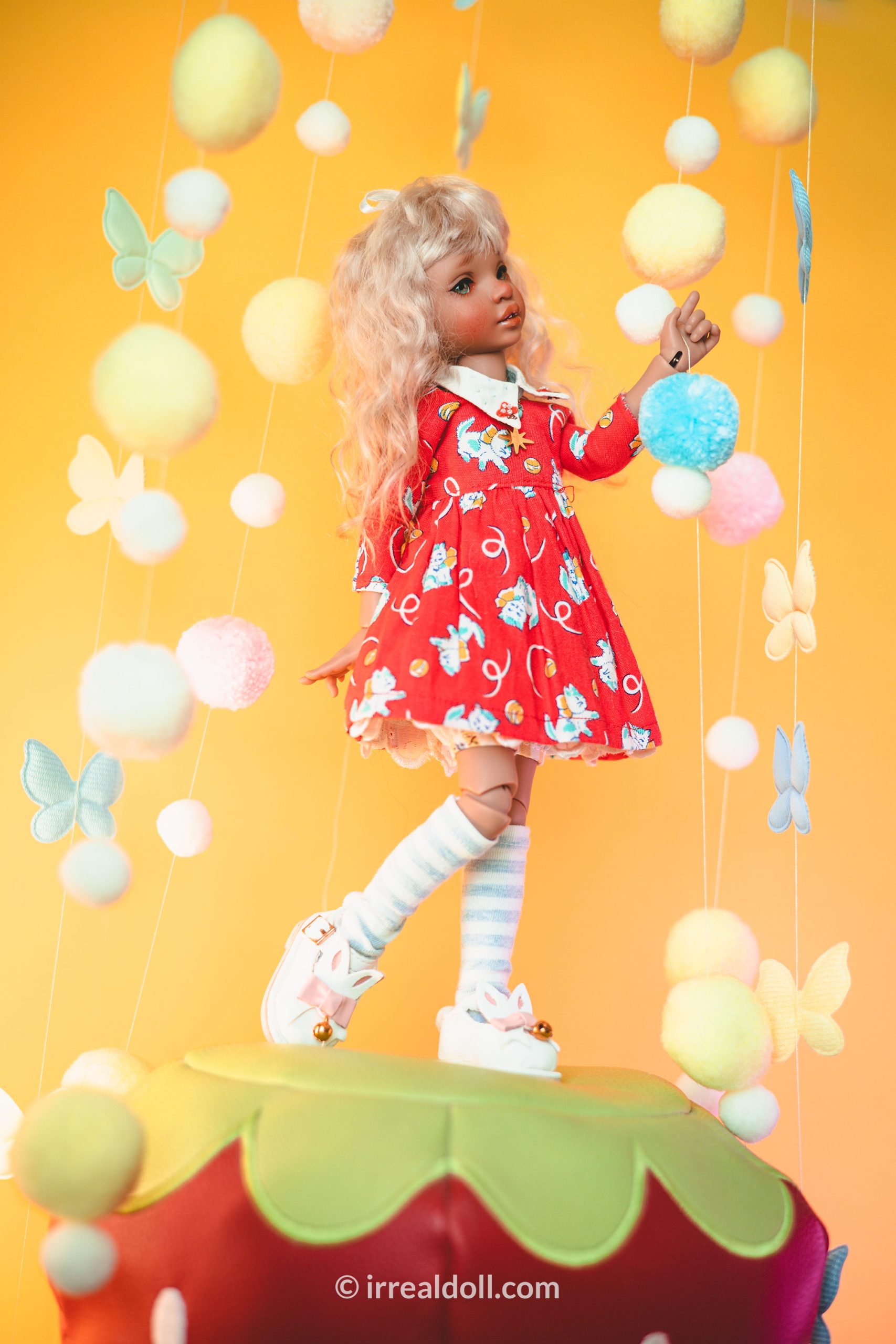 A picture of Surya, a 27cm tall doll from Irrealdoll in a dark skin tone.