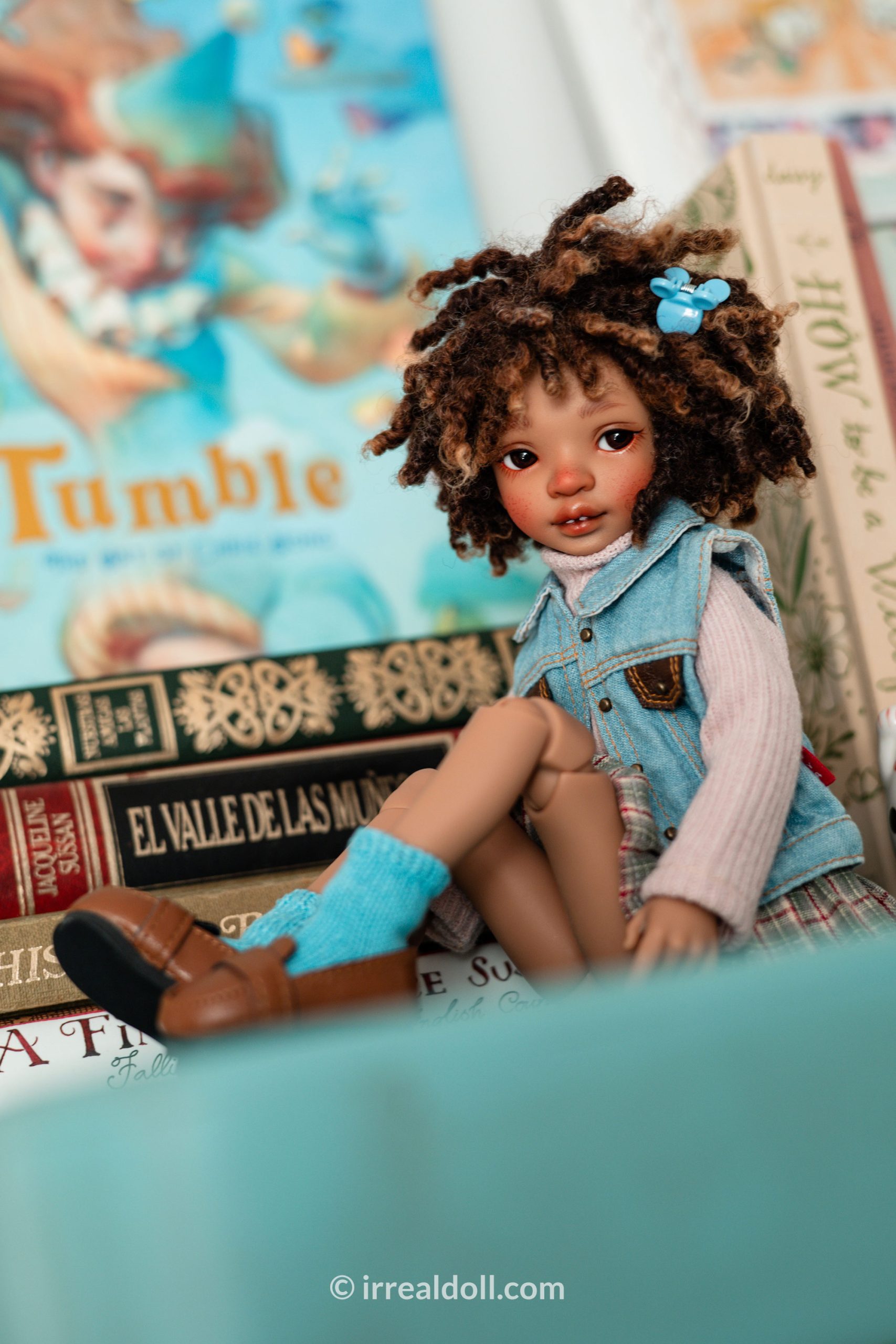 A picture of Surya, a 27cm tall doll from Irrealdoll in a dark skin tone.