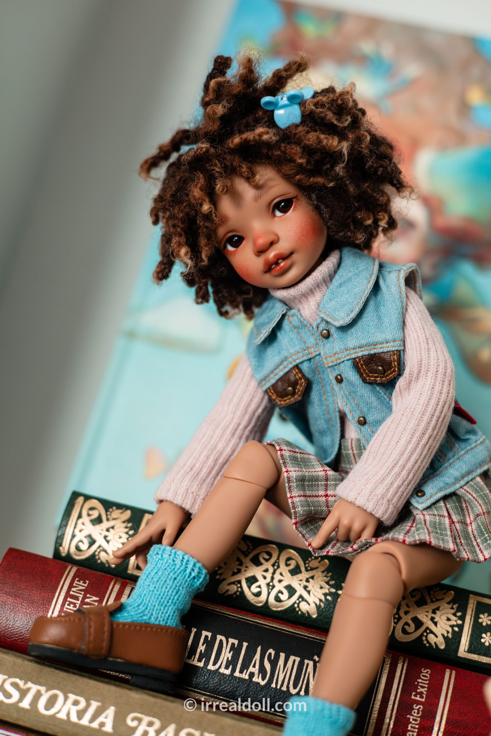 A picture of Surya, a 27cm tall doll from Irrealdoll in a dark skin tone.