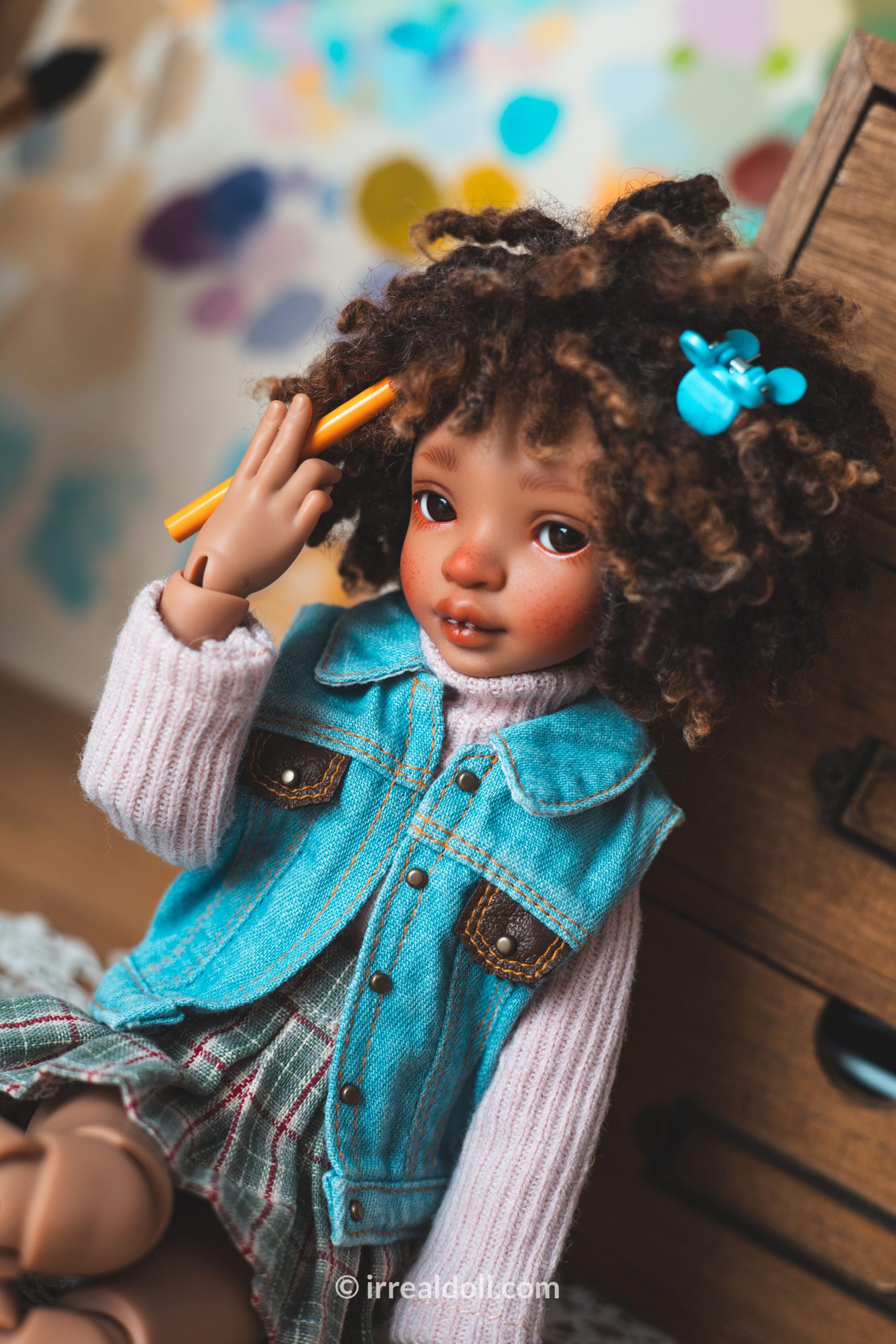 A picture of Surya, a 27cm tall doll from Irrealdoll in a dark skin tone.