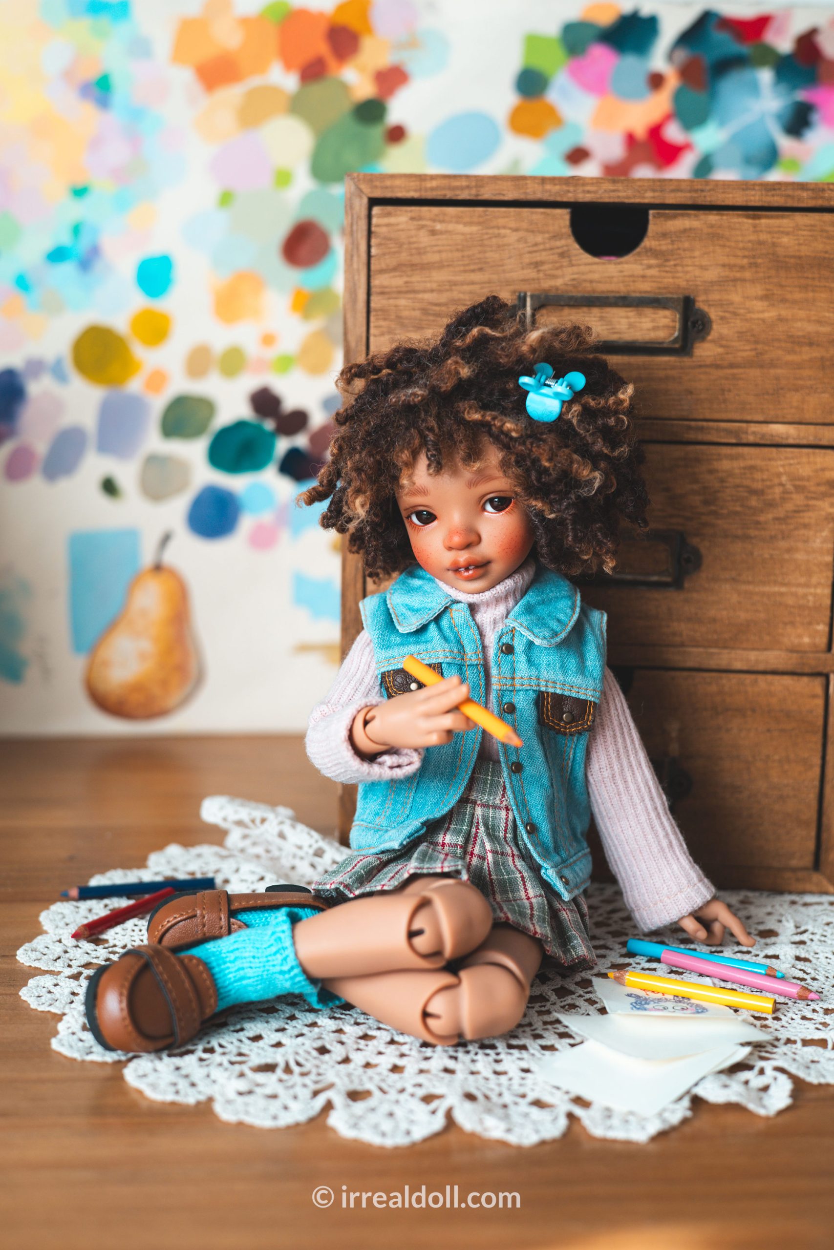 A picture of Surya, a 27cm tall doll from Irrealdoll in a dark skin tone.