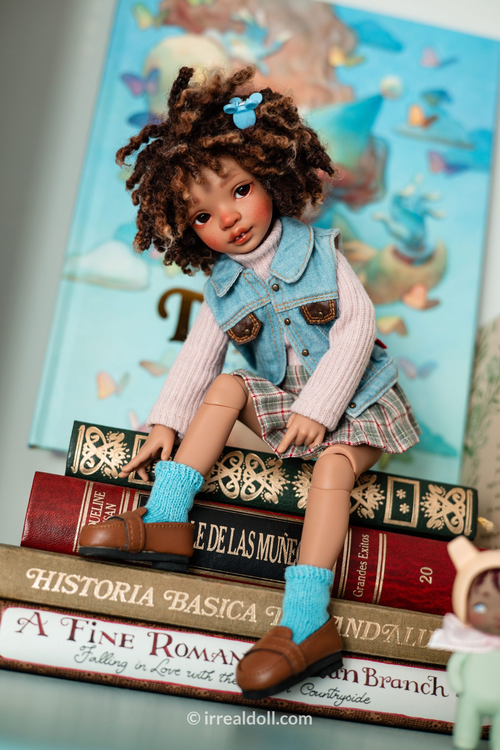 A picture of Surya, a 27cm tall doll from Irrealdoll in a dark skin tone.