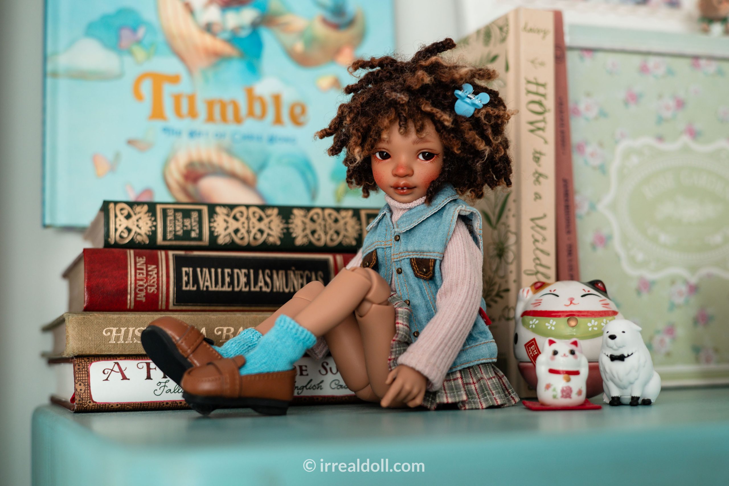 A picture of Surya, a 27cm tall doll from Irrealdoll in a dark skin tone.