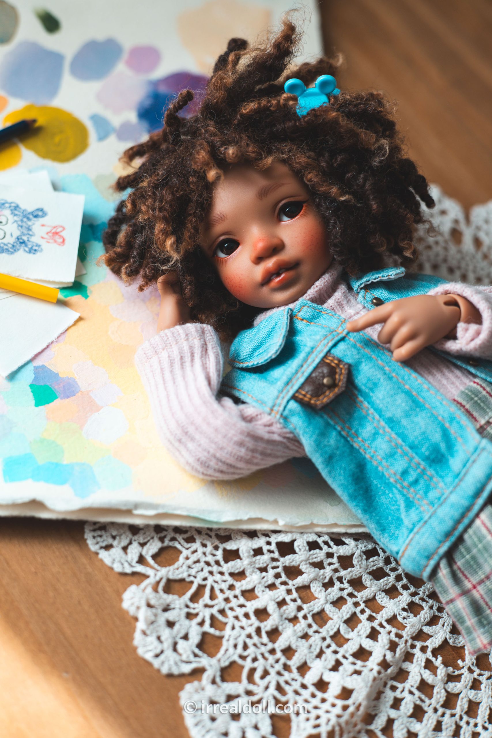 A picture of Surya, a 27cm tall doll from Irrealdoll in a dark skin tone.