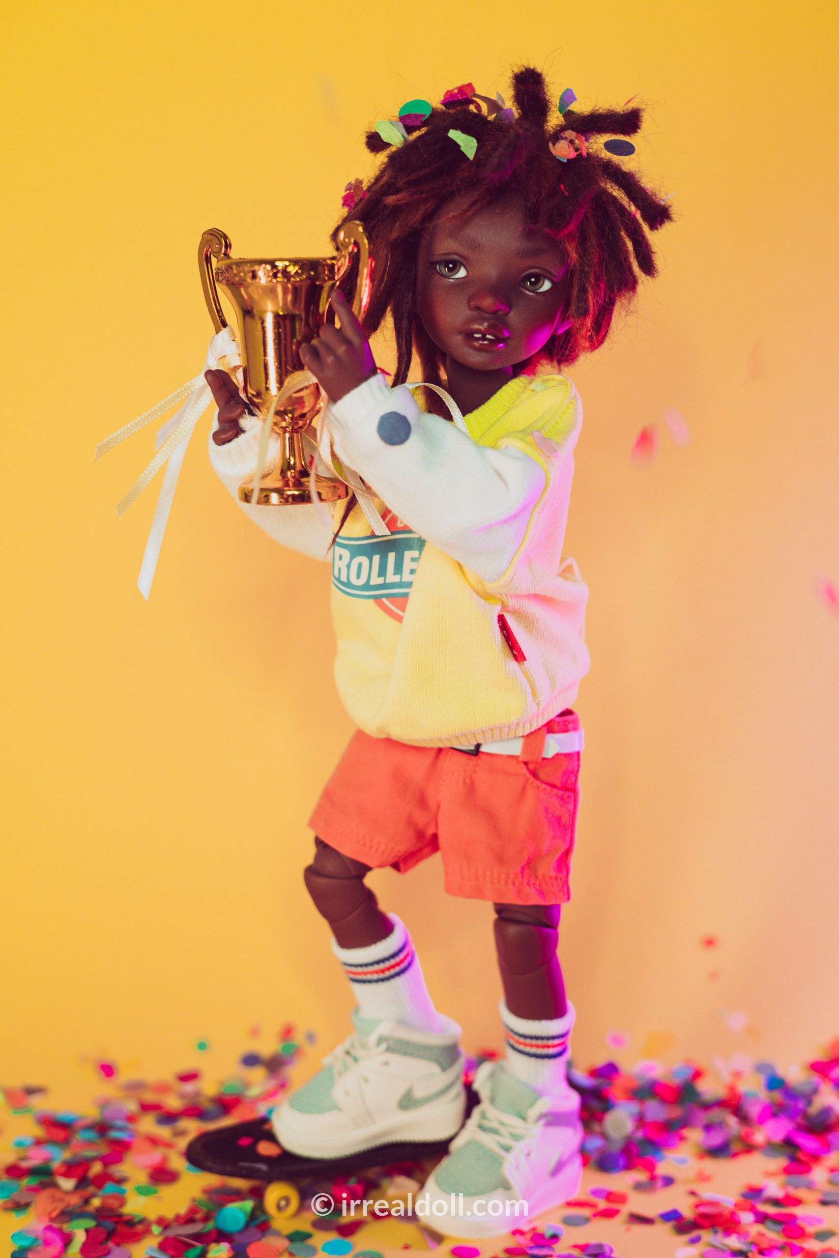 A picture of Surya, a 27cm tall doll from Irrealdoll in a dark skin tone.