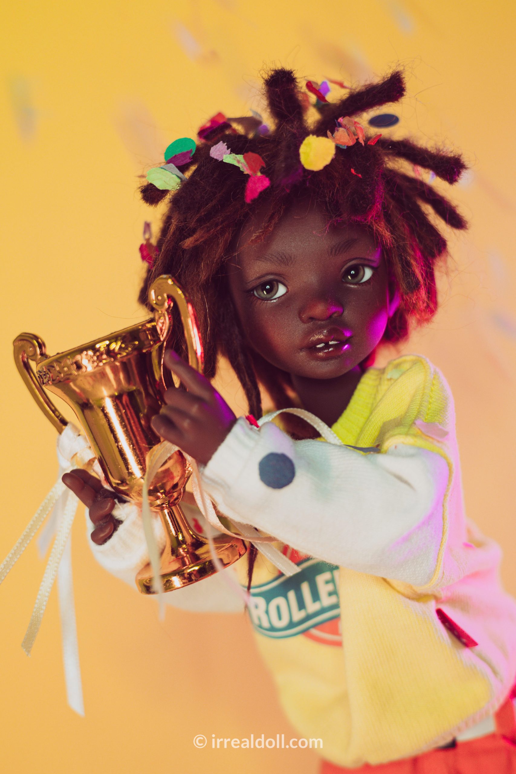 A picture of Surya, a 27cm tall doll from Irrealdoll in a dark skin tone.