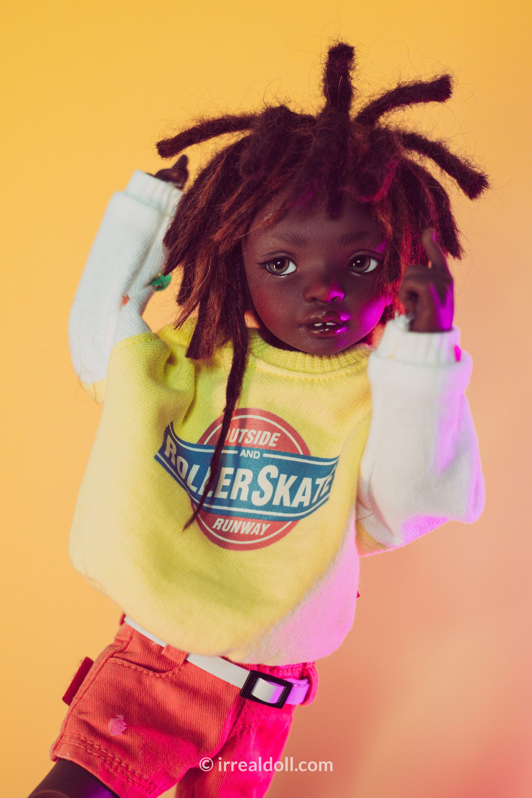 A picture of Surya, a 27cm tall doll from Irrealdoll in a dark skin tone.