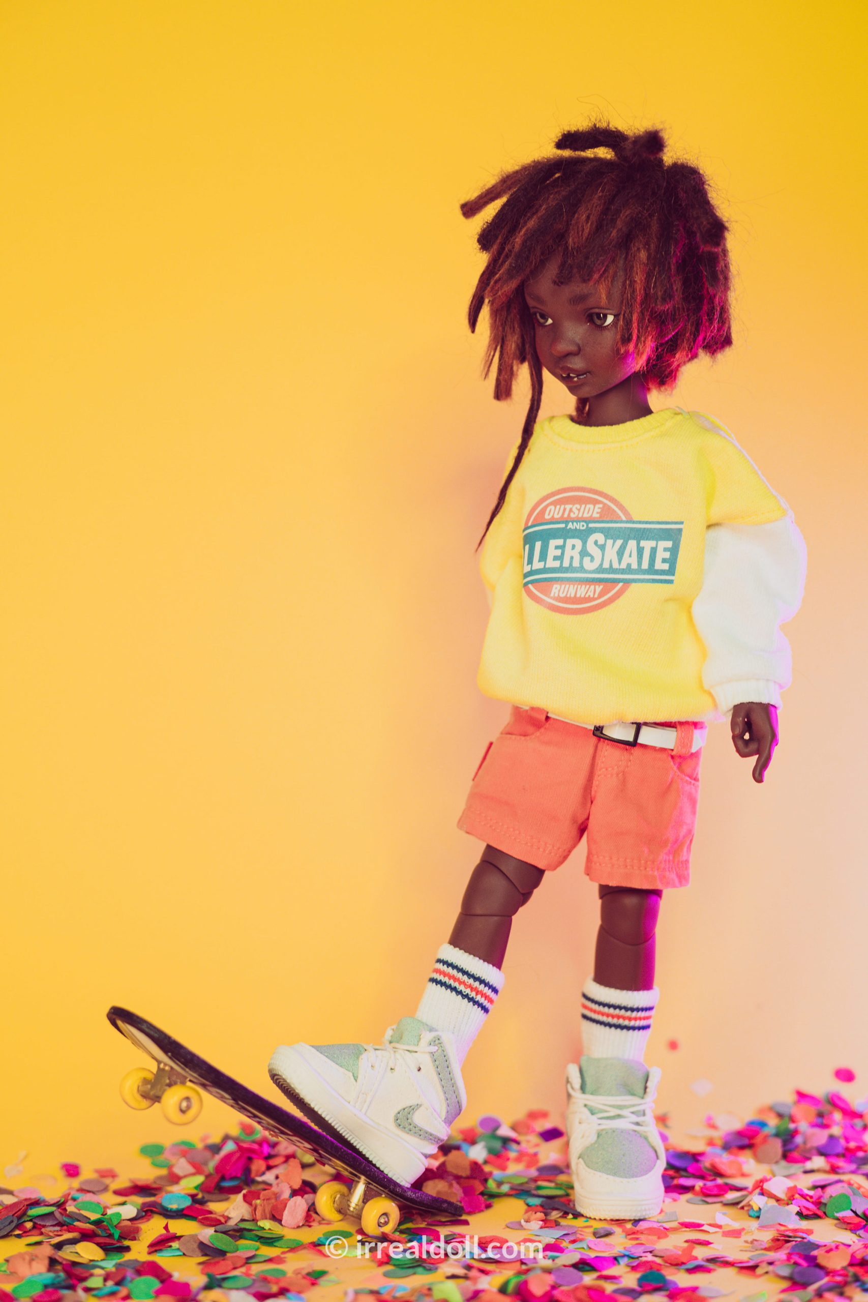 A picture of Surya, a 27cm tall doll from Irrealdoll in a dark skin tone.