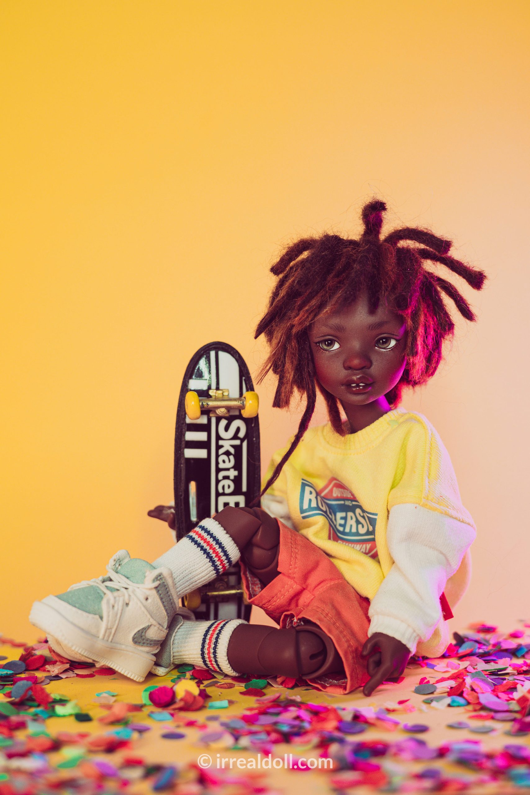 A picture of Surya, a 27cm tall doll from Irrealdoll in a dark skin tone.