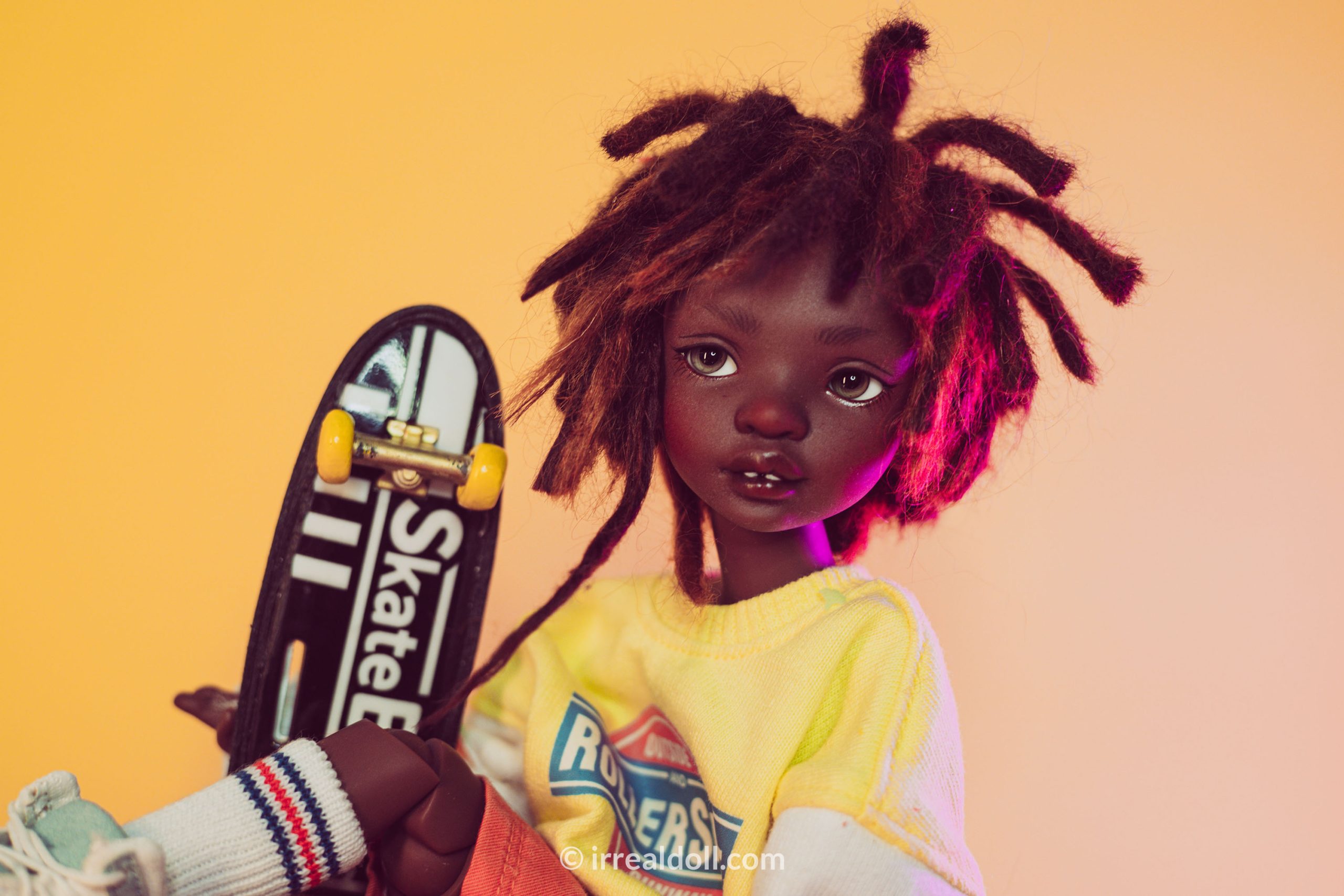 A picture of Surya, a 27cm tall doll from Irrealdoll in a dark skin tone.