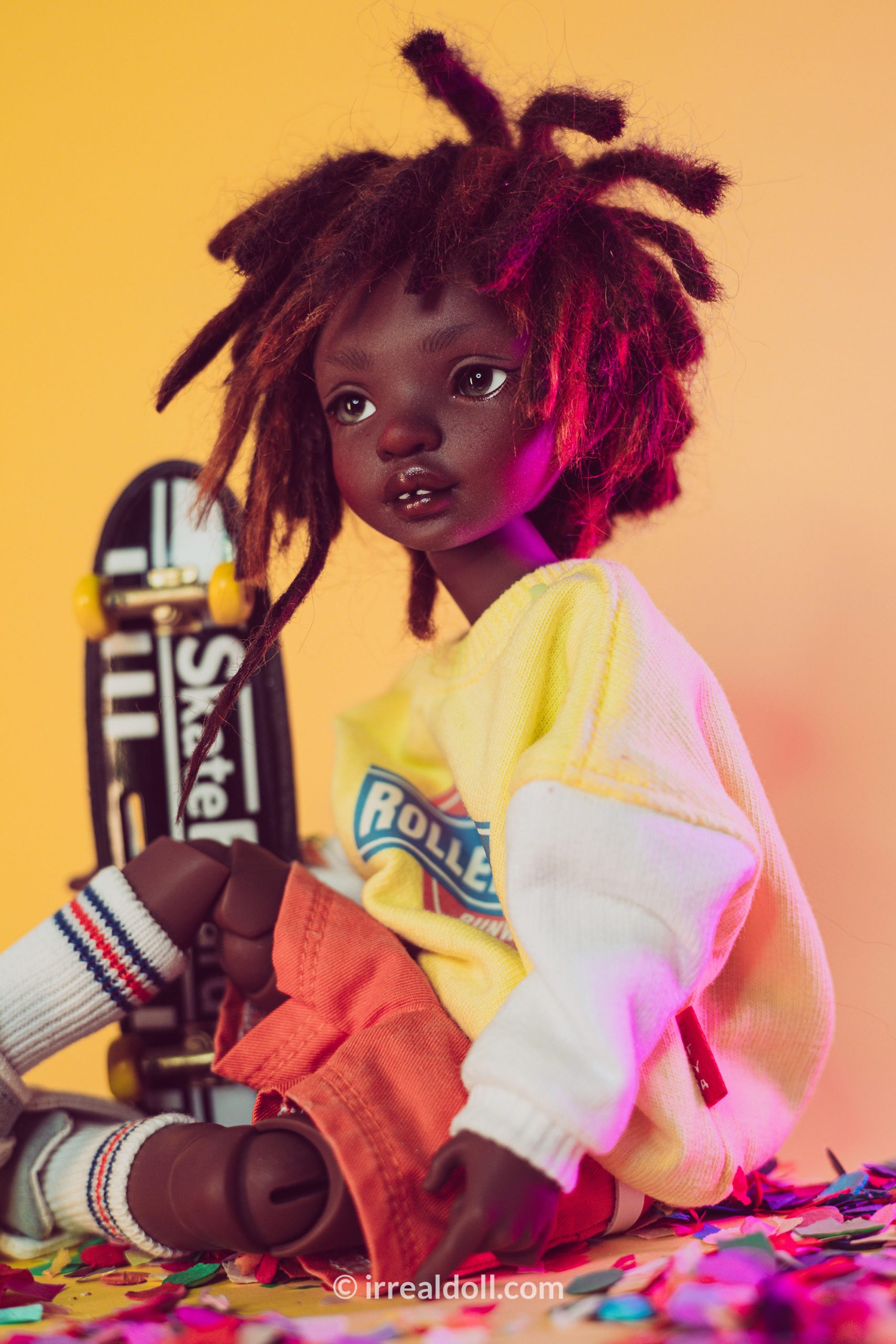 A picture of Surya, a 27cm tall doll from Irrealdoll in a dark skin tone.