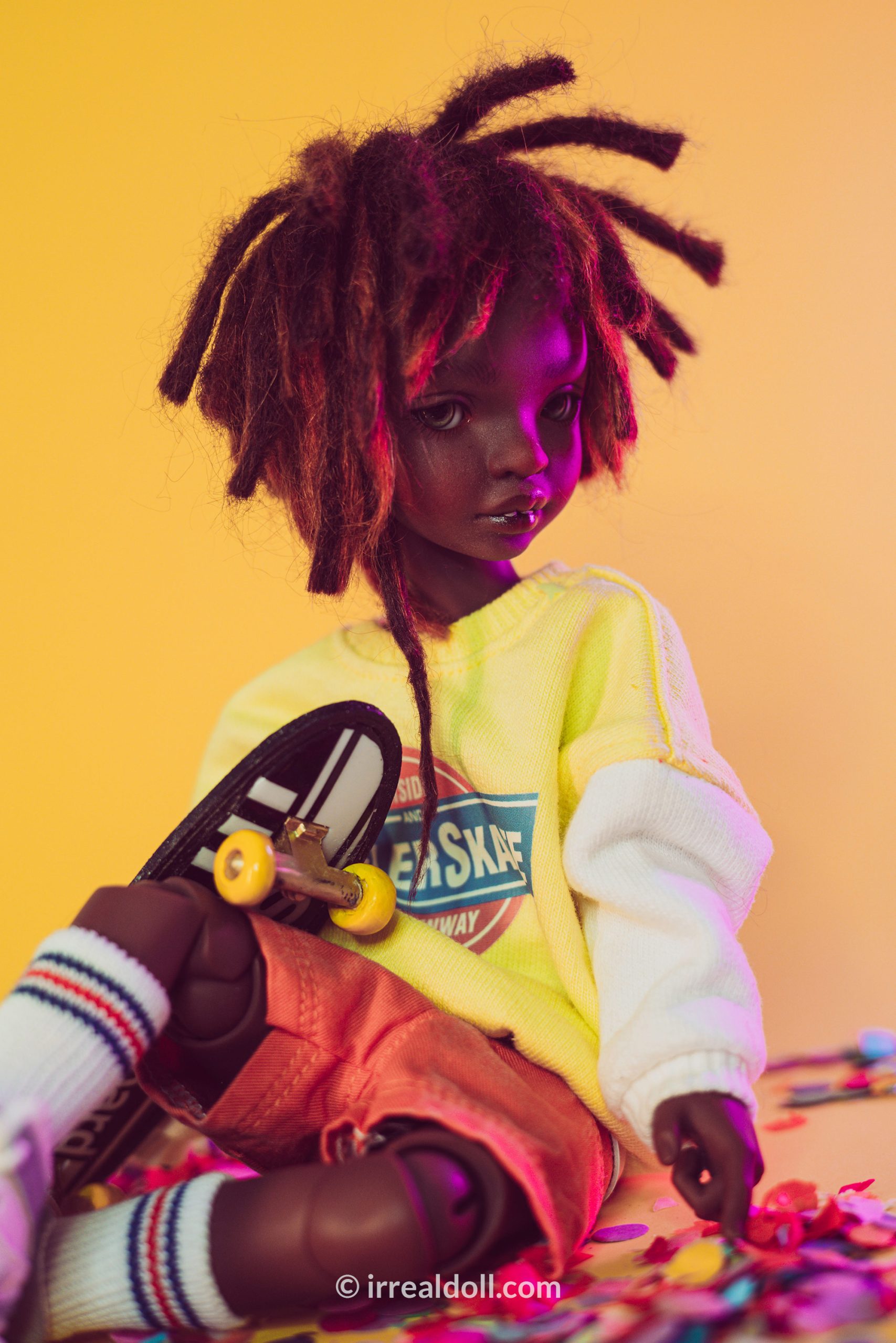 A picture of Surya, a 27cm tall doll from Irrealdoll in a dark skin tone.