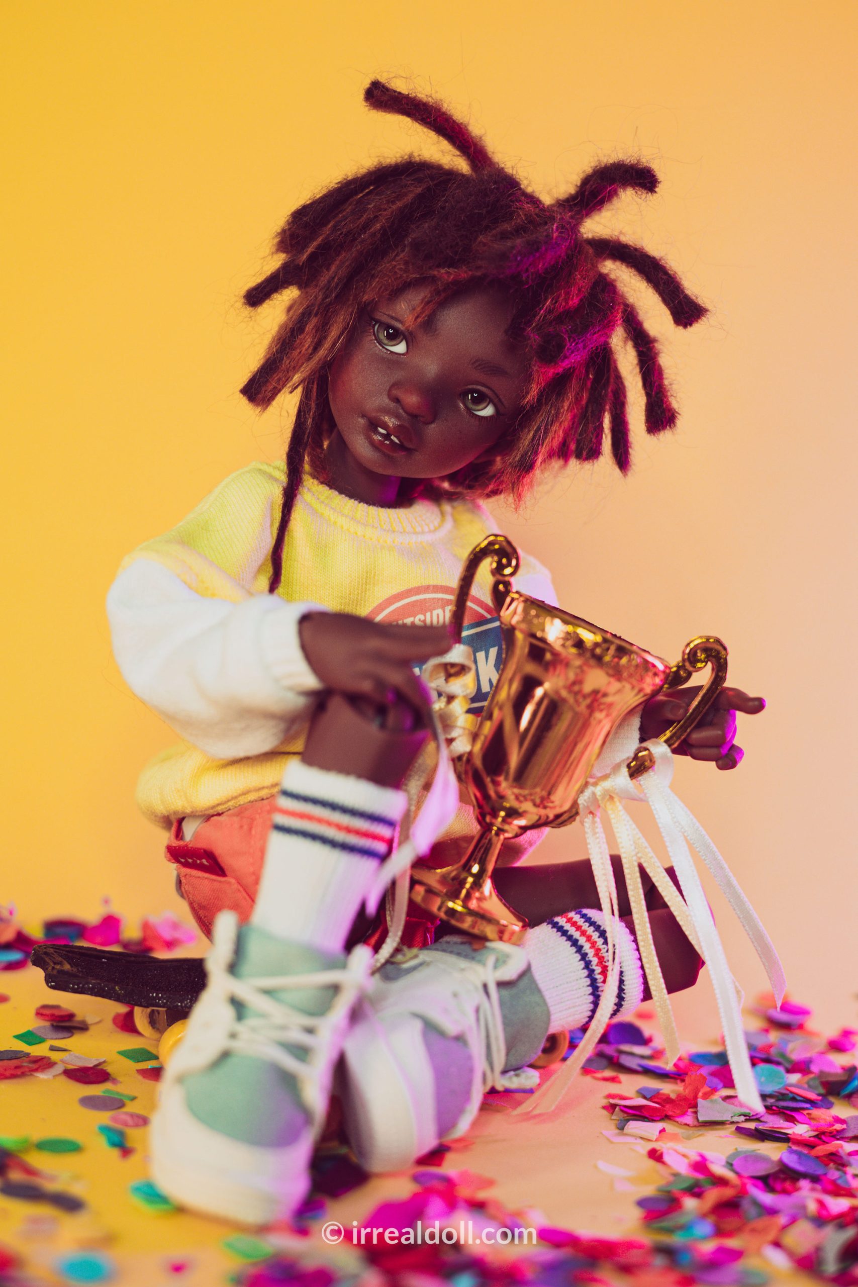 A picture of Surya, a 27cm tall doll from Irrealdoll in a dark skin tone.