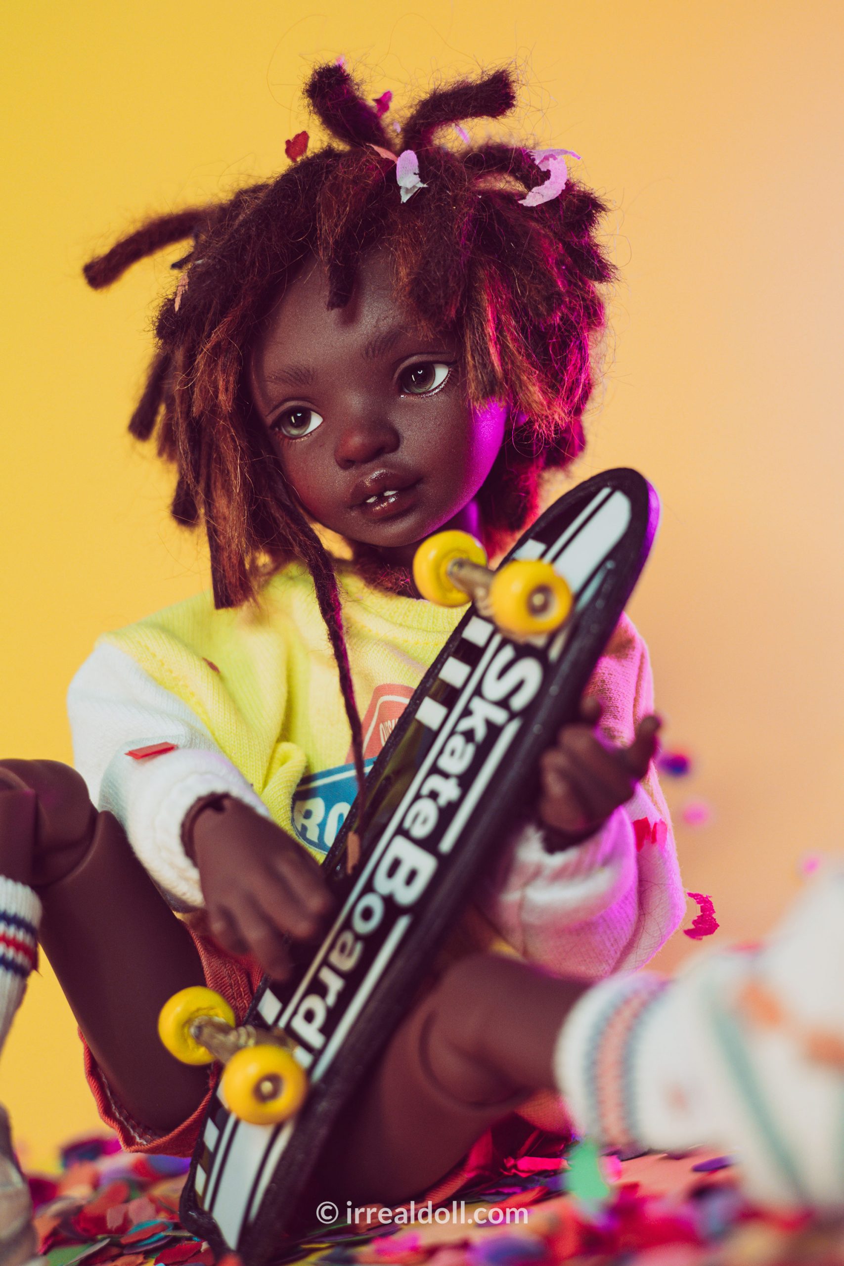 A picture of Surya, a 27cm tall doll from Irrealdoll in a dark skin tone.