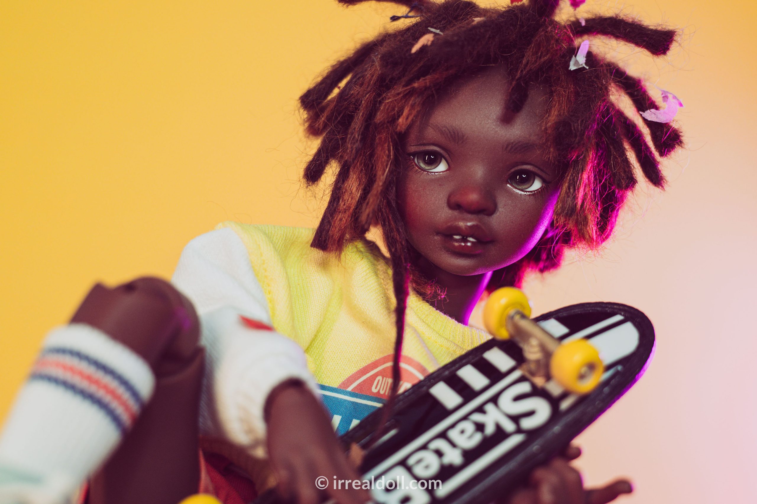 A picture of Surya, a 27cm tall doll from Irrealdoll in a dark skin tone.