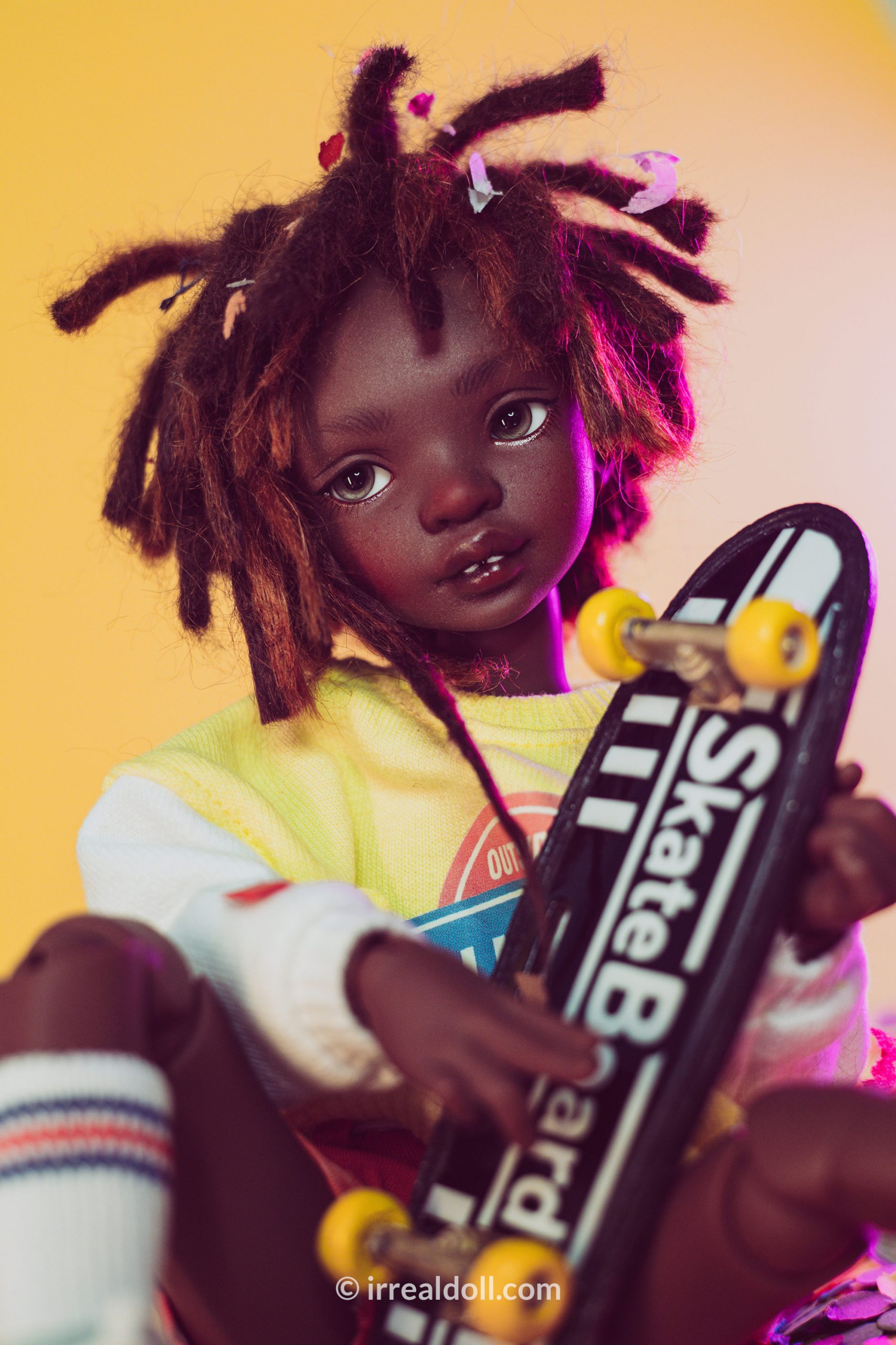 A picture of Surya, a 27cm tall doll from Irrealdoll in a dark skin tone.
