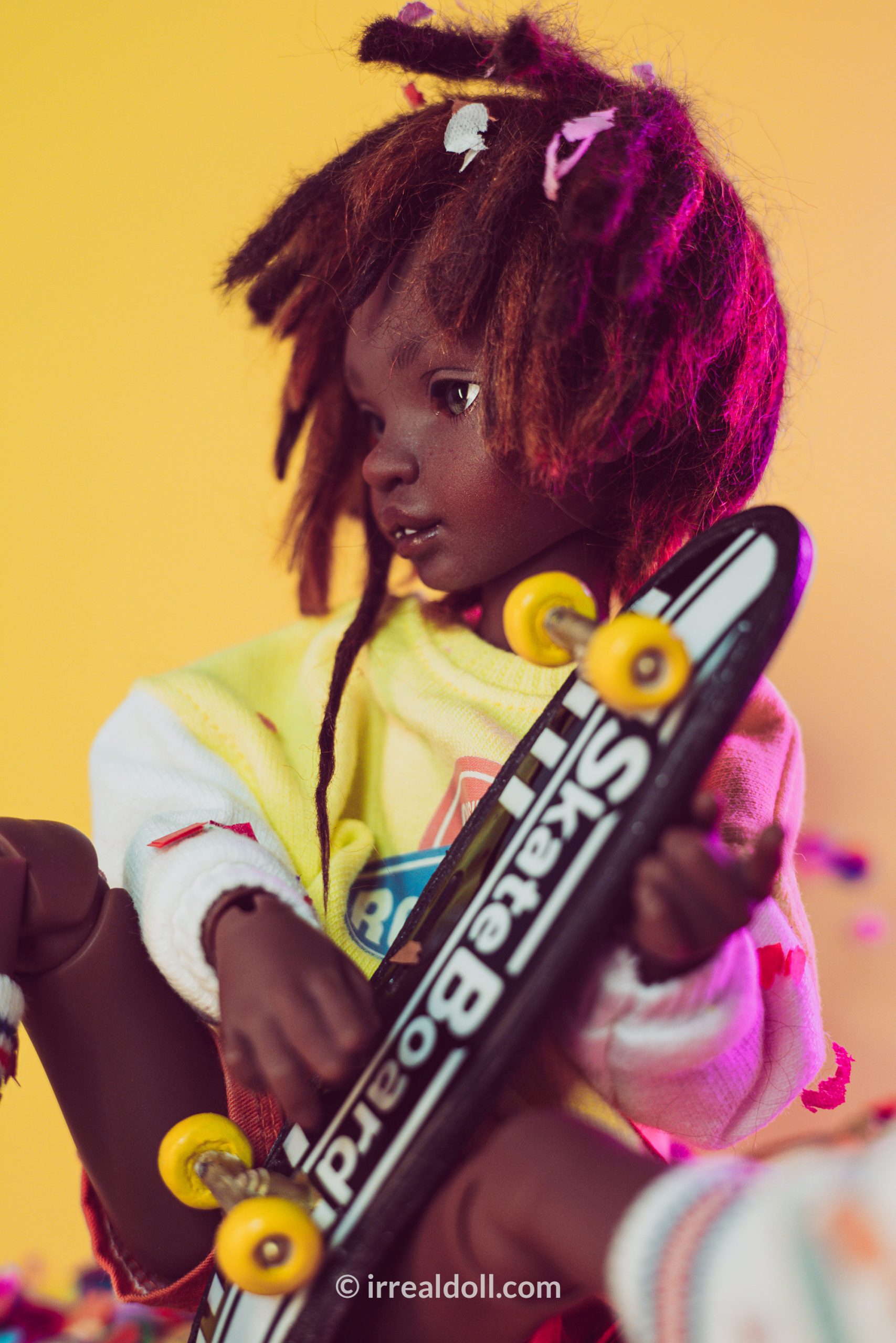 A picture of Surya, a 27cm tall doll from Irrealdoll in a dark skin tone.