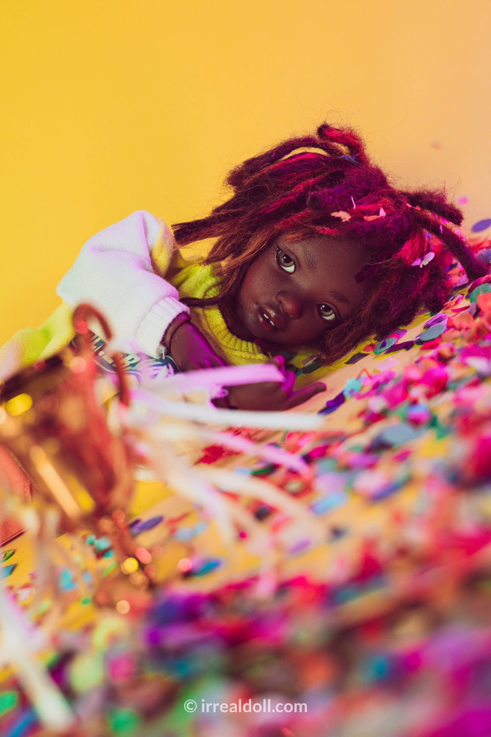 A picture of Surya, a 27cm tall doll from Irrealdoll in a dark skin tone.