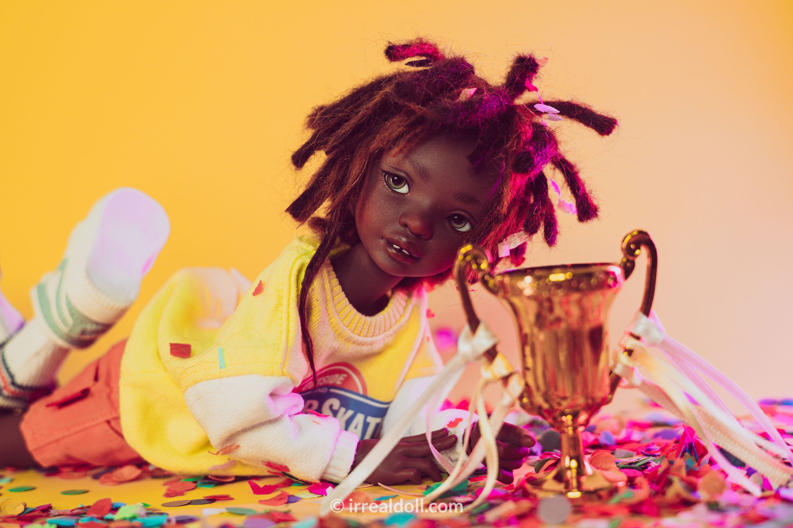 A picture of Surya, a 27cm tall doll from Irrealdoll in a dark skin tone.