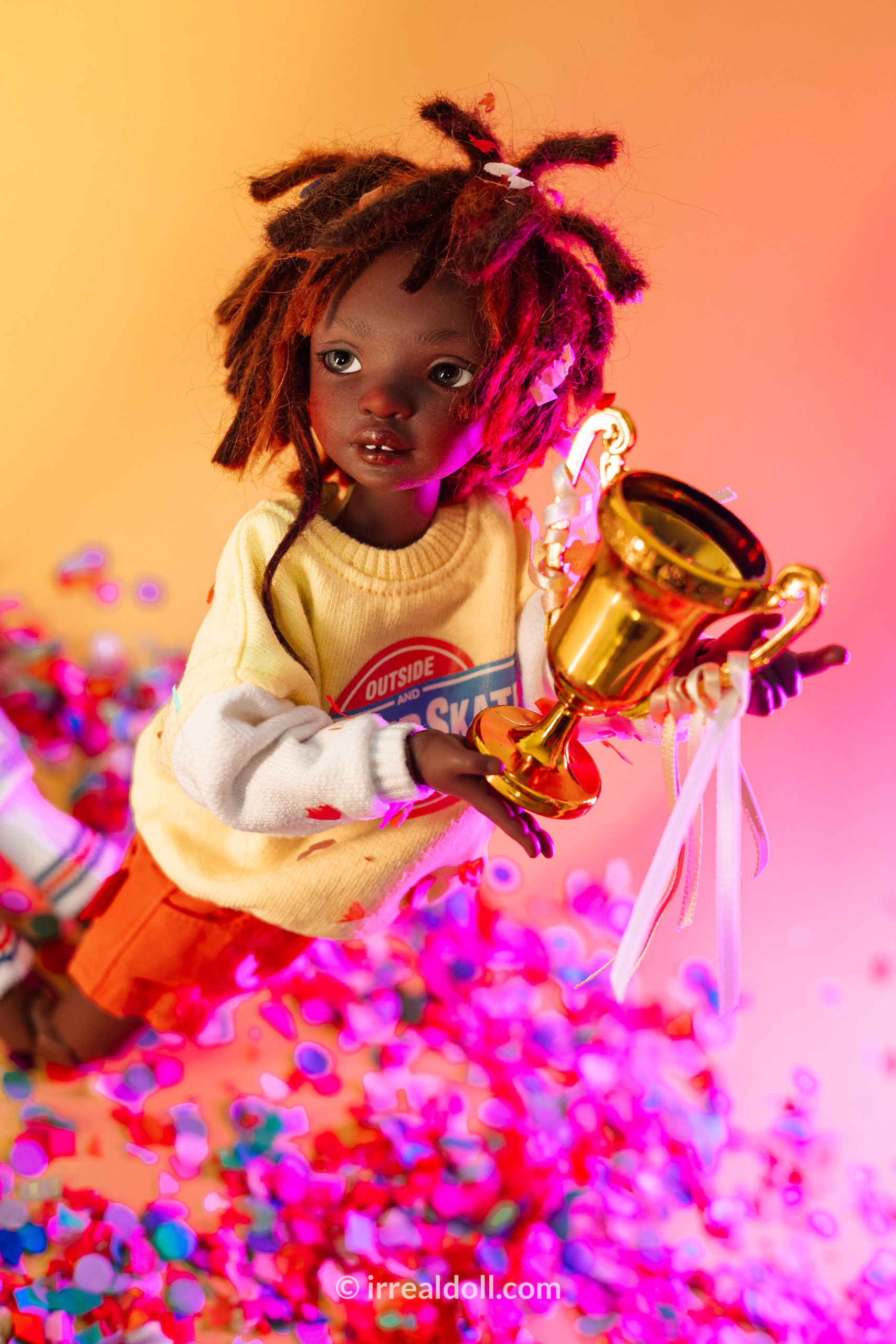 A picture of Surya, a 27cm tall doll from Irrealdoll in a dark skin tone.