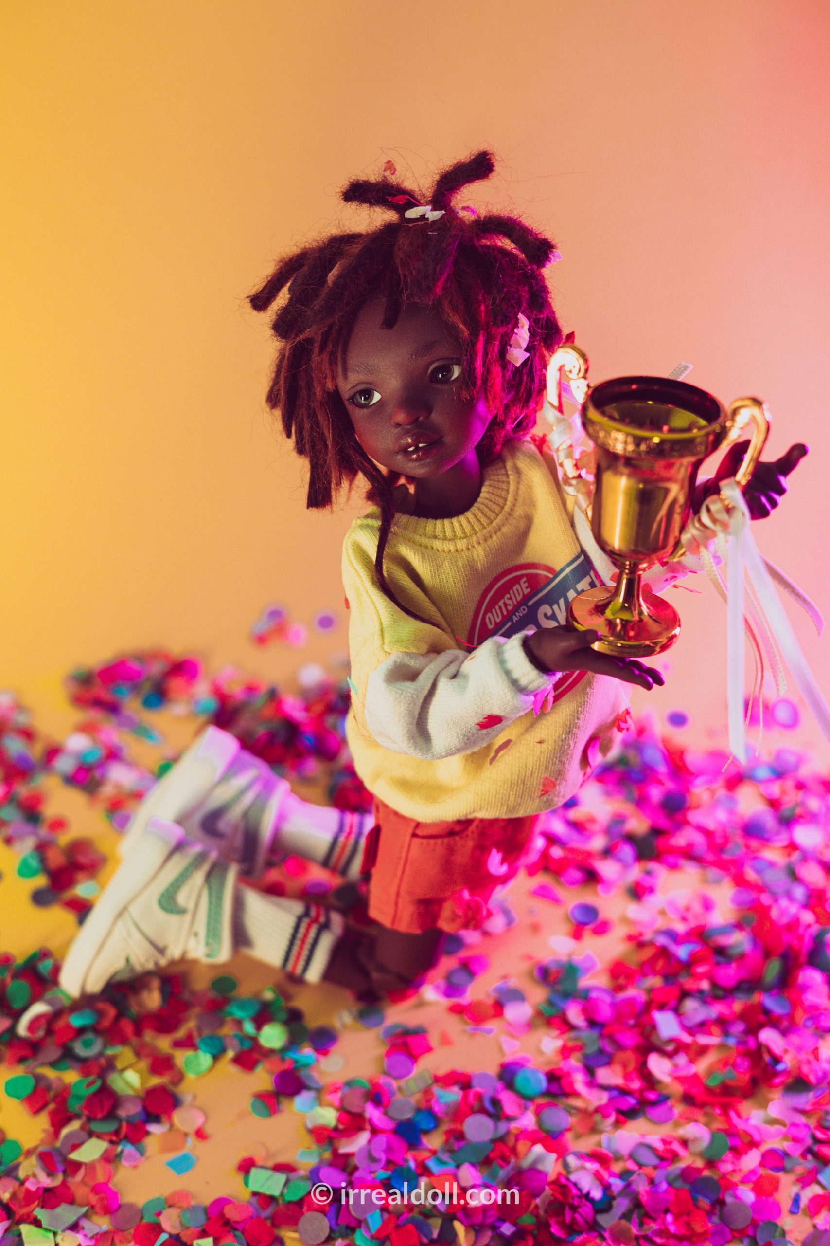 A picture of Surya, a 27cm tall doll from Irrealdoll in a dark skin tone.