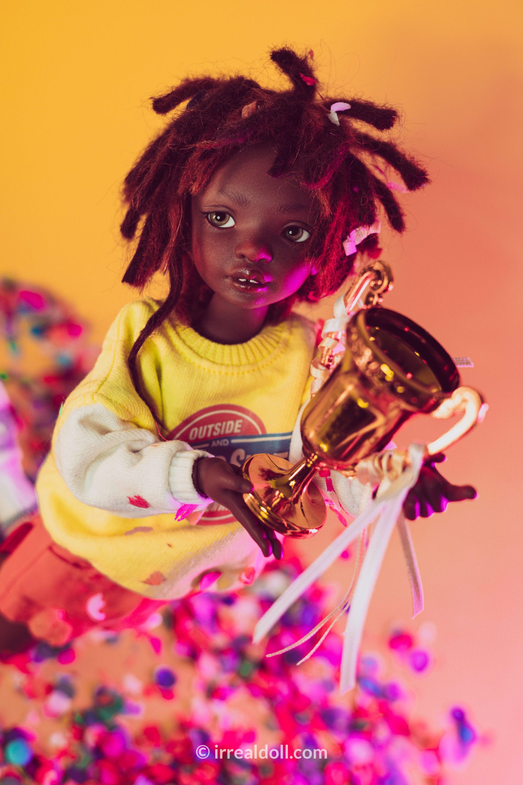 A picture of Surya, a 27cm tall doll from Irrealdoll in a dark skin tone.